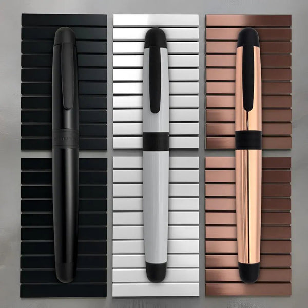 Sleek executive pen shells featuring matte silver Arctic Shadow, stealth Phantom Black, and rich Copper Eclipse finishes